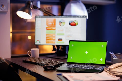 Preview: Empty business office with green screen chroma key mock up laptop computer