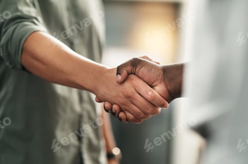 Preview: Cropped shot of a two unrecognizable businessmen standing in the office together and shaking hands