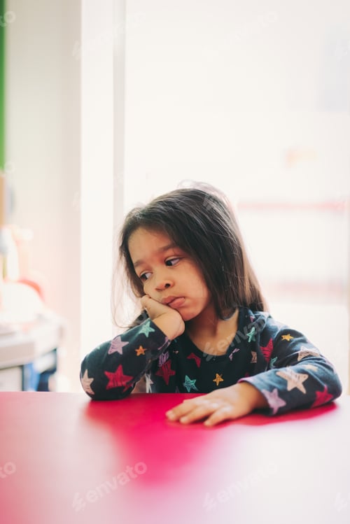 Preview: Mixed race 3 year old looking very bored