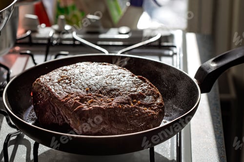 Preview: Frying a piece of beef meat in the pan