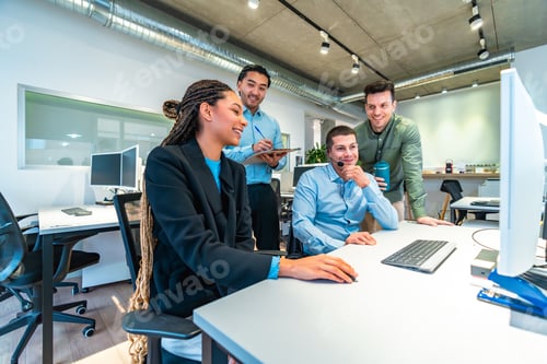 Preview: Business team collaborating on computer in modern office