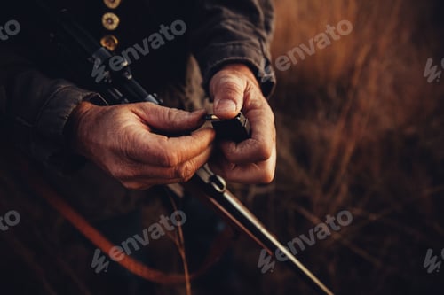 Preview: Hunter fills his rifle with bullets
