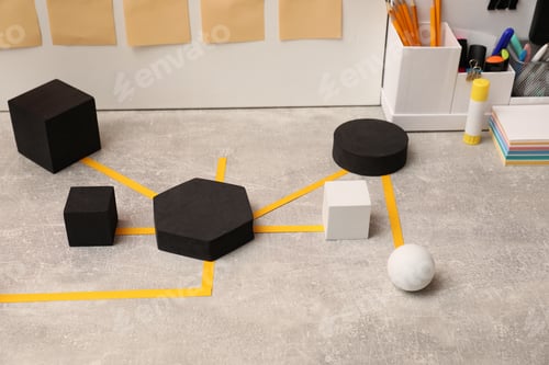 Preview: Business process scheme with geometric figures and stationery on light grey table