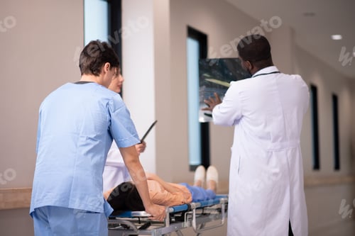 Preview: medics and patient on hospital gurney at emergency