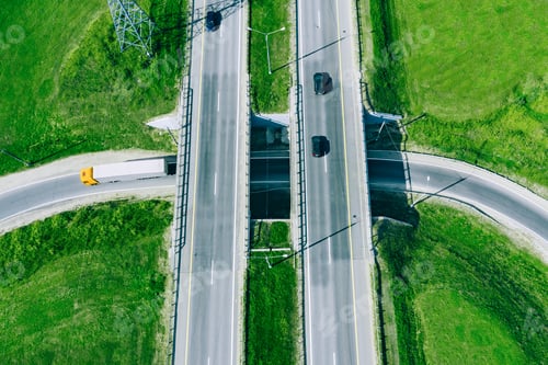 Preview: Aerial drone view of highway asphalt road with cars and cargo trucks.