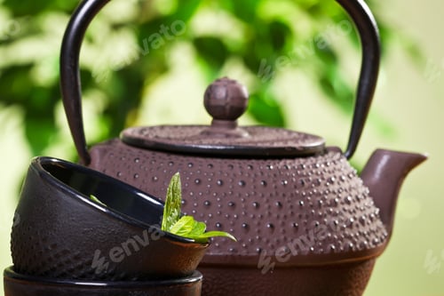 Preview: Kettle and closeup fresh mint leaves in a tea cup