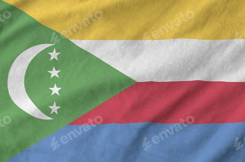 Preview: Comoros flag depicted on folded wavy fabric of old cloth