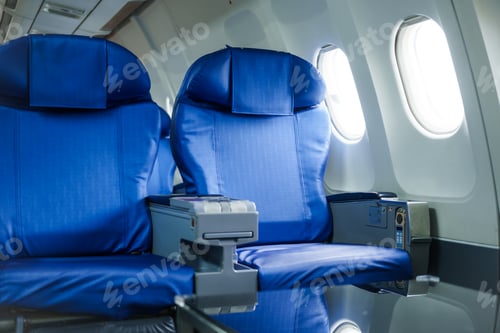 Preview: A modern airplane seat with a window view, perfect for business or leisure travel.