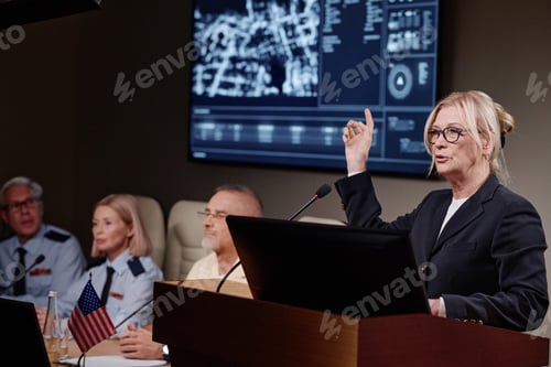 Preview: Businesswoman giving presentation at conference