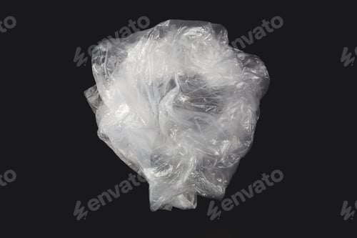 Preview: White Plastic Bag On Black Background. A White Plastic Bag Texture, Macro, Background. Reduction Of
