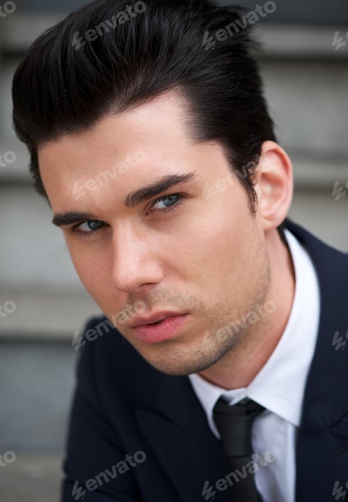 Preview: Portrait of an attractive young man posing outdoors