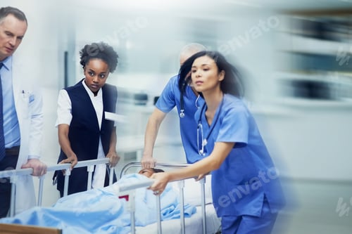 Preview: Shot of a group of medical professionals rushing a patient on a gurney down a hospital corridor