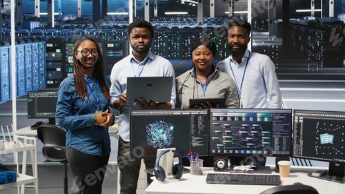 Preview: Portrait of smiling data center technicians analyze issues using node tree tool