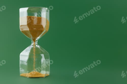 Preview: Gold hourglass on dark green paper background