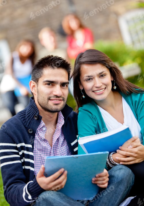 Preview: Happy Couple Of Students With A Notebook And Smiling Outdoors