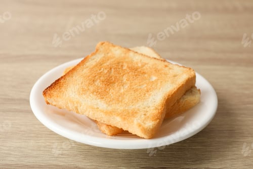 Preview: Plate with toasts on wooden background, close up