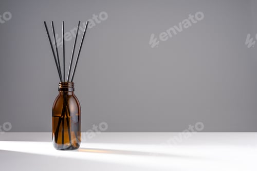 Preview: Aroma diffuser with natural essential oil in a brown glass bottle on a white and gray background