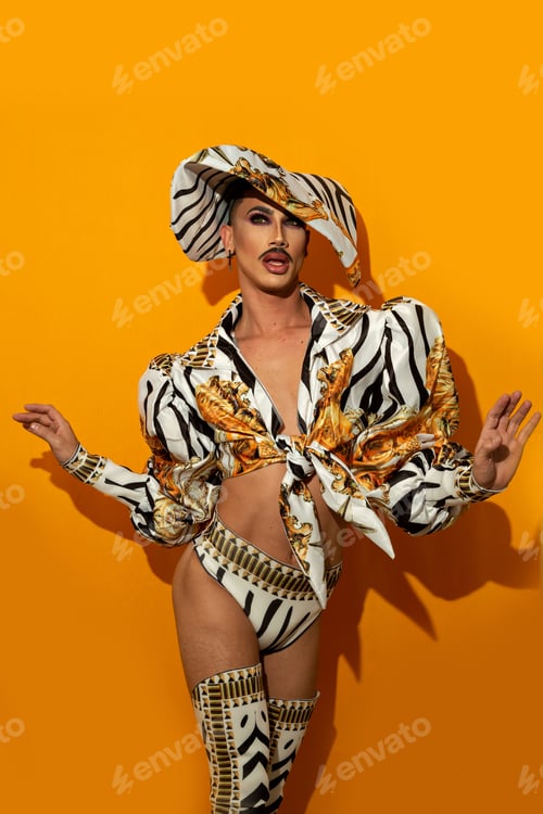 Preview: Beautiful drag queen with fashionable mustache with yellow background.