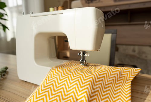 Preview: A white sewing machine standing on the table ready for work