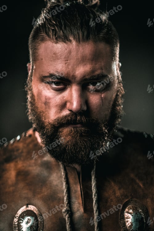 Preview: Viking with cold weapon in a traditional warrior clothes
