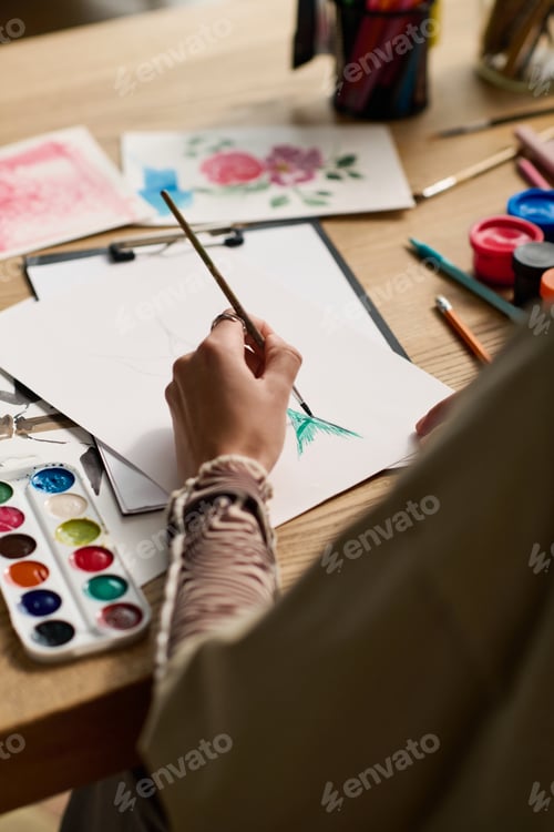 Preview: Adult Painting a Watercolor Design on Paper