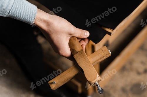 Preview: Craftsman shaping leather belt blanks with cutter knife