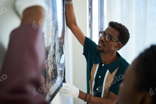 Preview: Professional Art Curator Organizing Gallery Exhibit