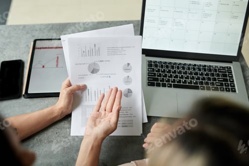 Preview: Marketing Managers Discussing Report