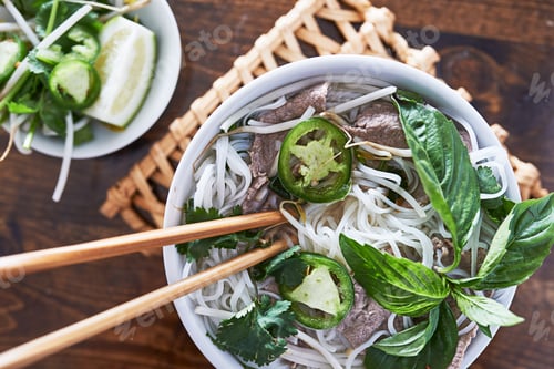 Preview: overhead photo of eating vietnamese beef pho