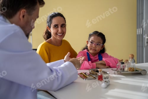 Preview: Male doctor and girl young patient Talk and give advice about your illness at the hospital.