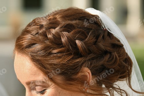 Preview: Red hair of the bride braided