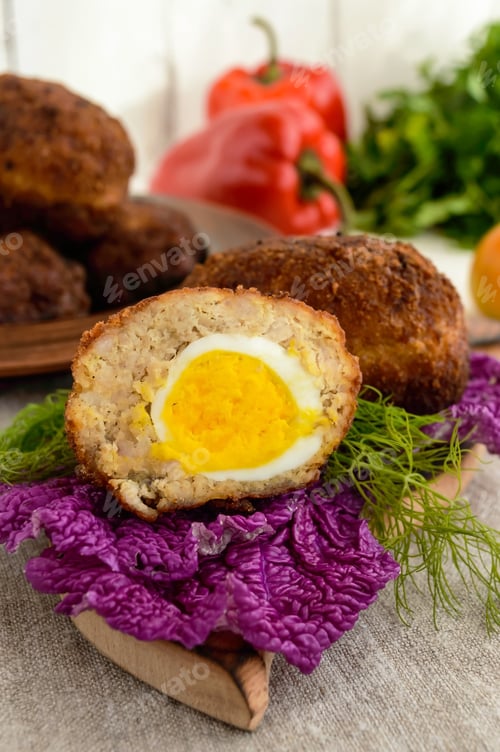 Preview: Meat mini-rolls (cutlet) with boiled egg. Close up