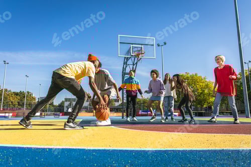 Preview: Multiracial group of young friends bonding outdoors
