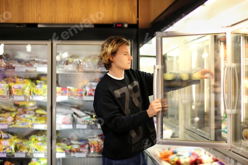 Preview: Man Shopping In Supermarket, Reading Product Information
