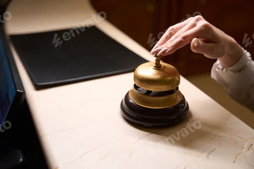 Preview: Woman presses the bell button to call the porter