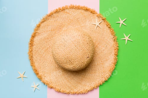 Preview: Summer women female accessories straw hat with seashell on a colored background, summer beach