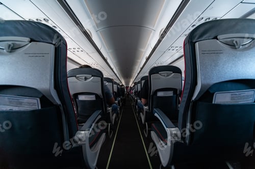 Preview: Airplane cabin seats with passengers. Economy class of new cheapest low-cost airlines