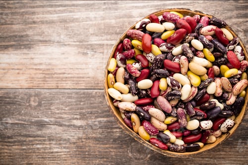 Preview: Beans on the bowl and wooden background.