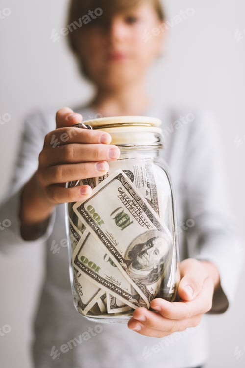 Preview: Kid save money. Put money in a piggy bank