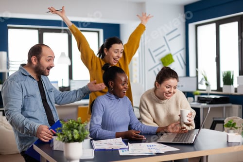 Preview: Young diverse group of entrepreneurs with hands up looking surprised