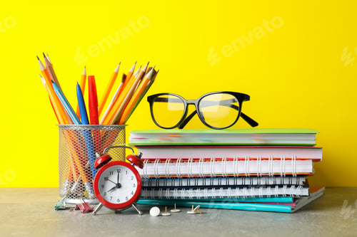 Preview: Glasses and stationary on grey table. Study concept