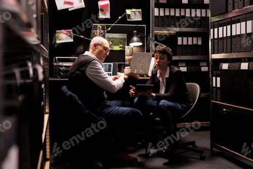 Preview: Criminology coworkers analyzing confidential crime evidence