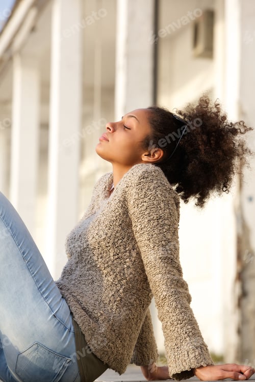 Preview: Young woman relaxing outside