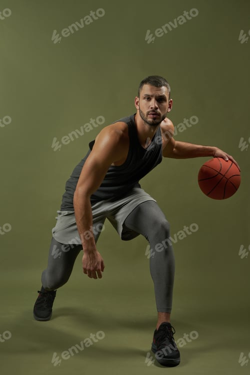 Preview: Adult Caucasian bearded sportsman playing in basket ball in the indoors