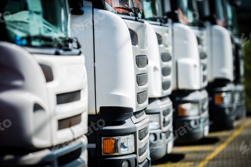 Preview: Trucks Lined up in a Storage Yard During Daytime