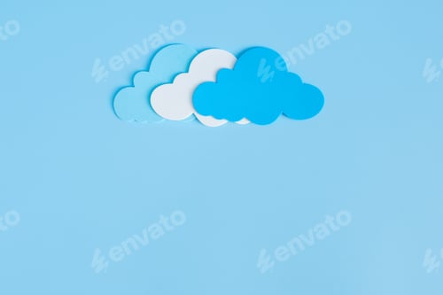 Preview: Light blue, white and blue paper cut clouds on blue background with copy space