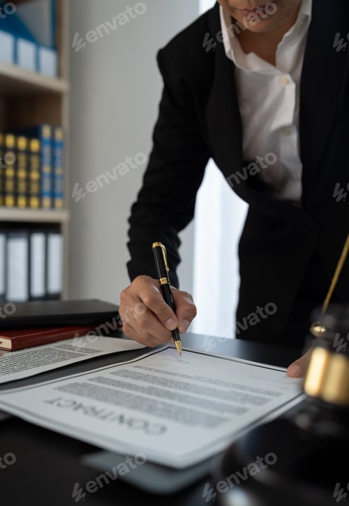 Preview: Confident lawyer or businessman examining details in real estate legal contract document Legal servi