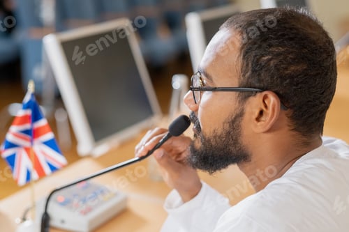 Preview: Young confident businessman or politician speaking in microphone