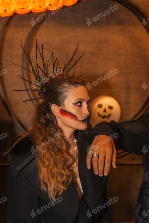Preview: Halloween party with friends in a disco, portrait of a woman with her face made up and painted