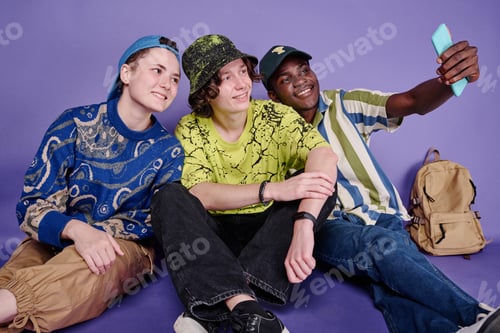 Preview: Teenagers making selfie portrait on mobile phone